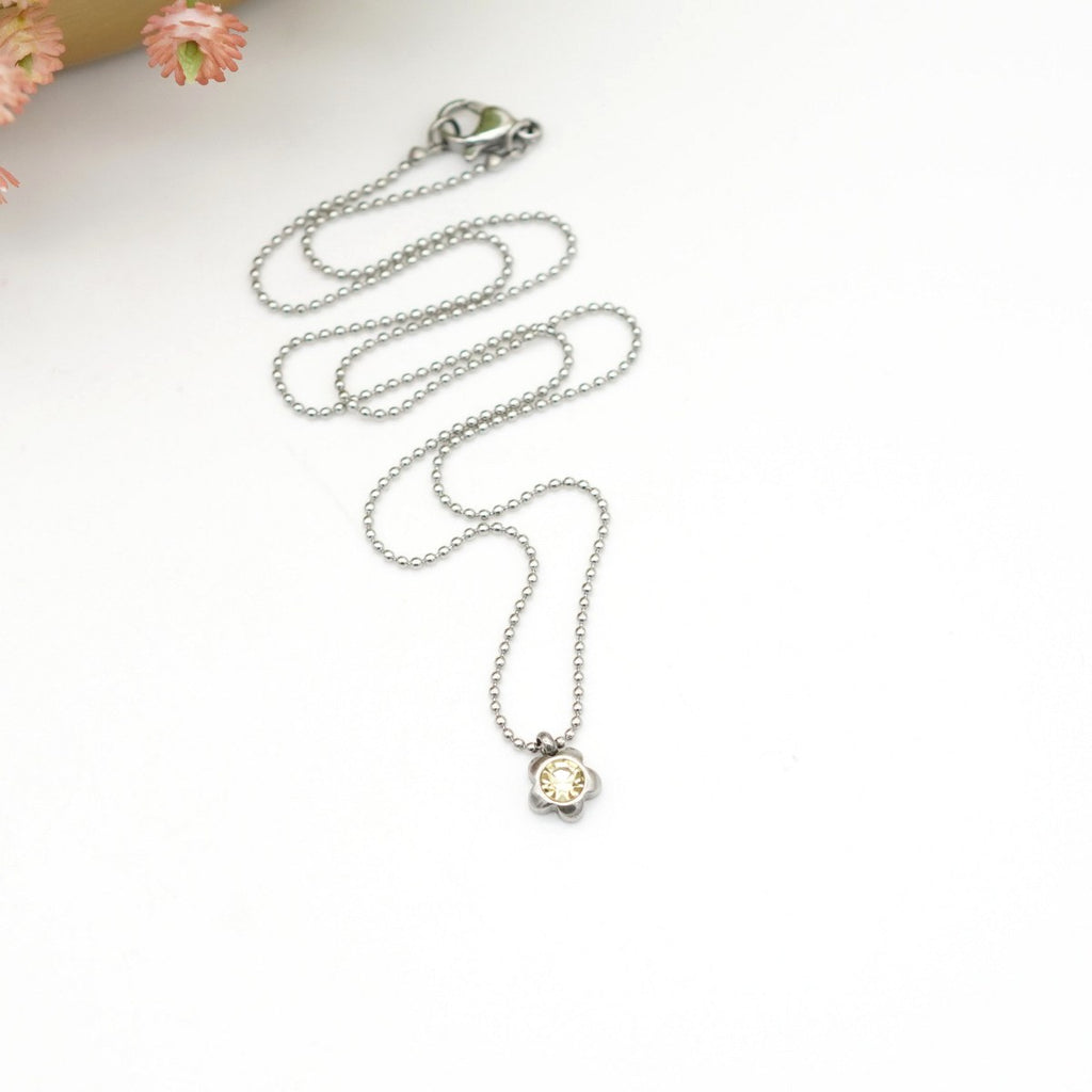 Edelstahl-Halskette mit Blumen-Anhänger & gelbem Kristallstein