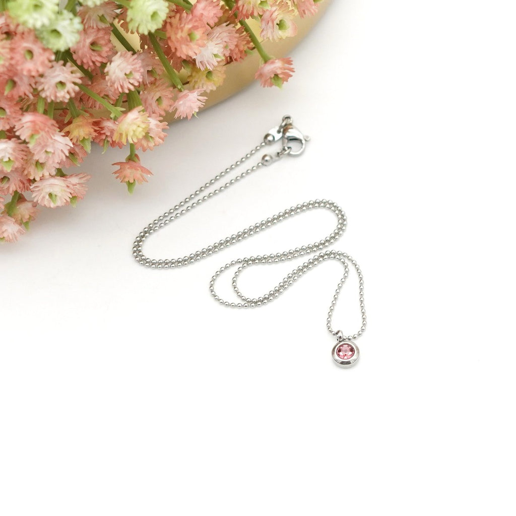 Edelstahl-Halskette mit runden Anhänger & rosa Kristallstein